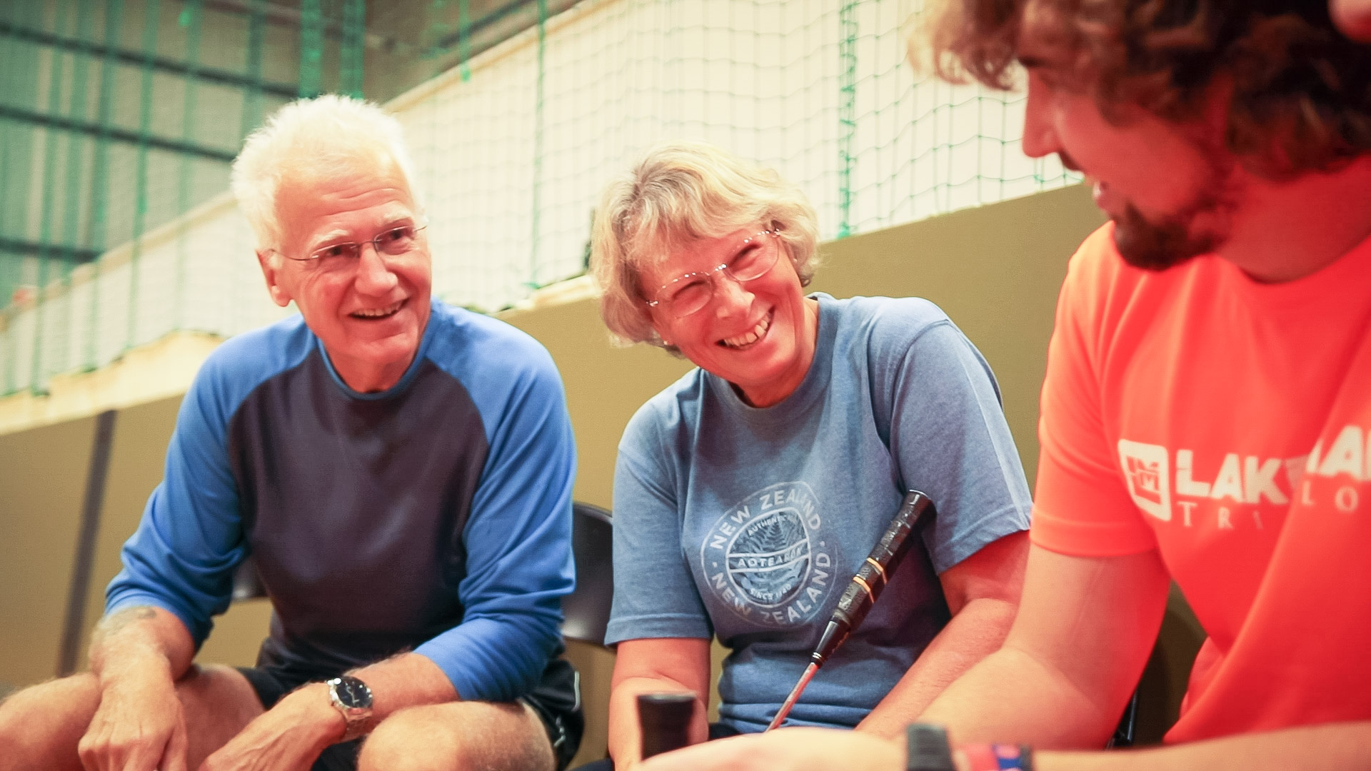 Old & young play badminton