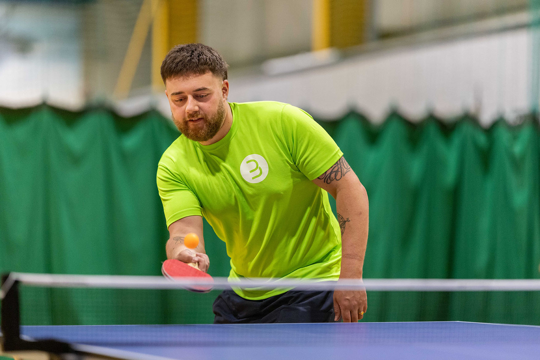 Man plays table tennis at Barrow Leisure centre